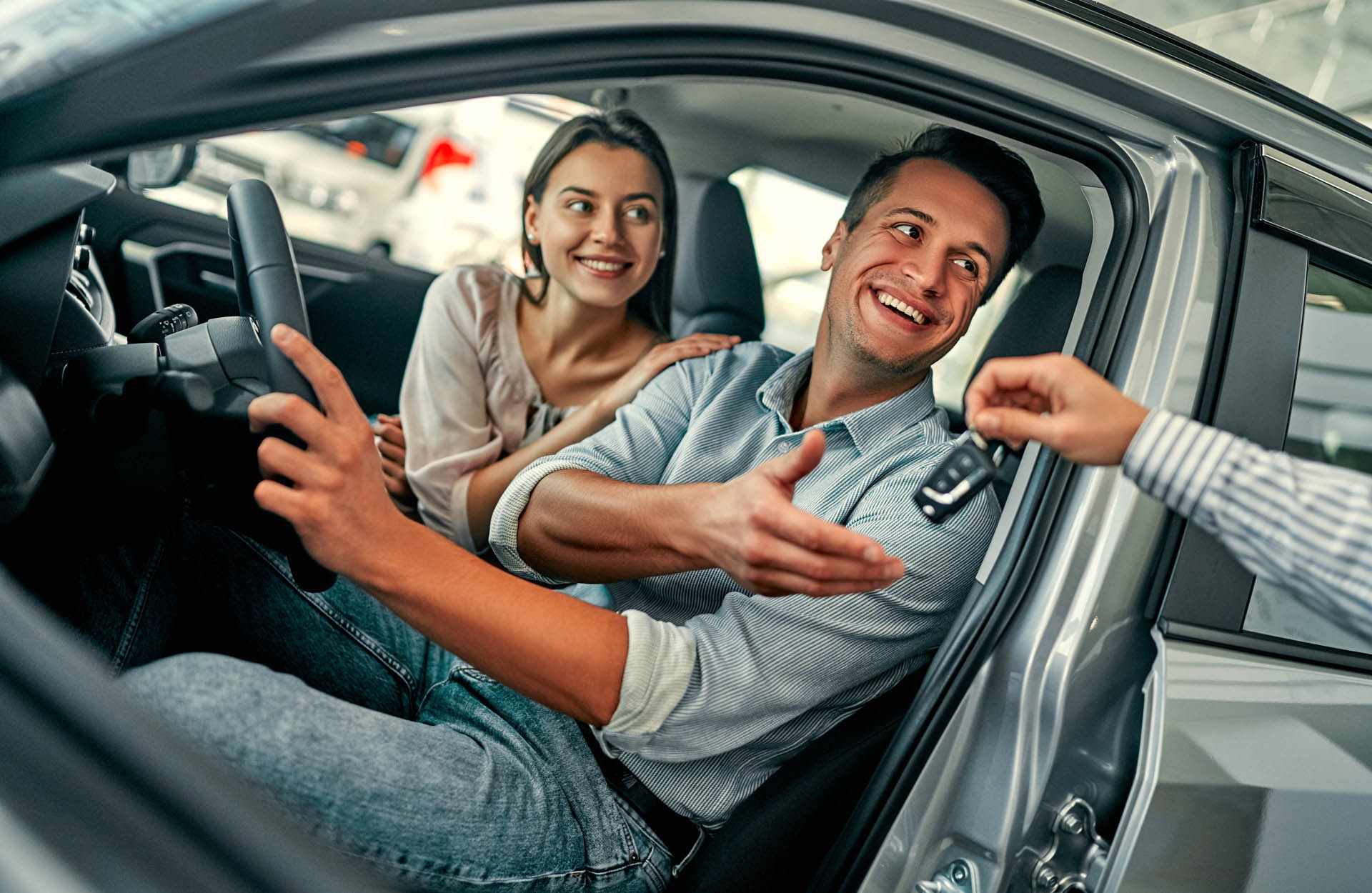 A couple uses their used car loan to buy a great pre-owned vehicle.