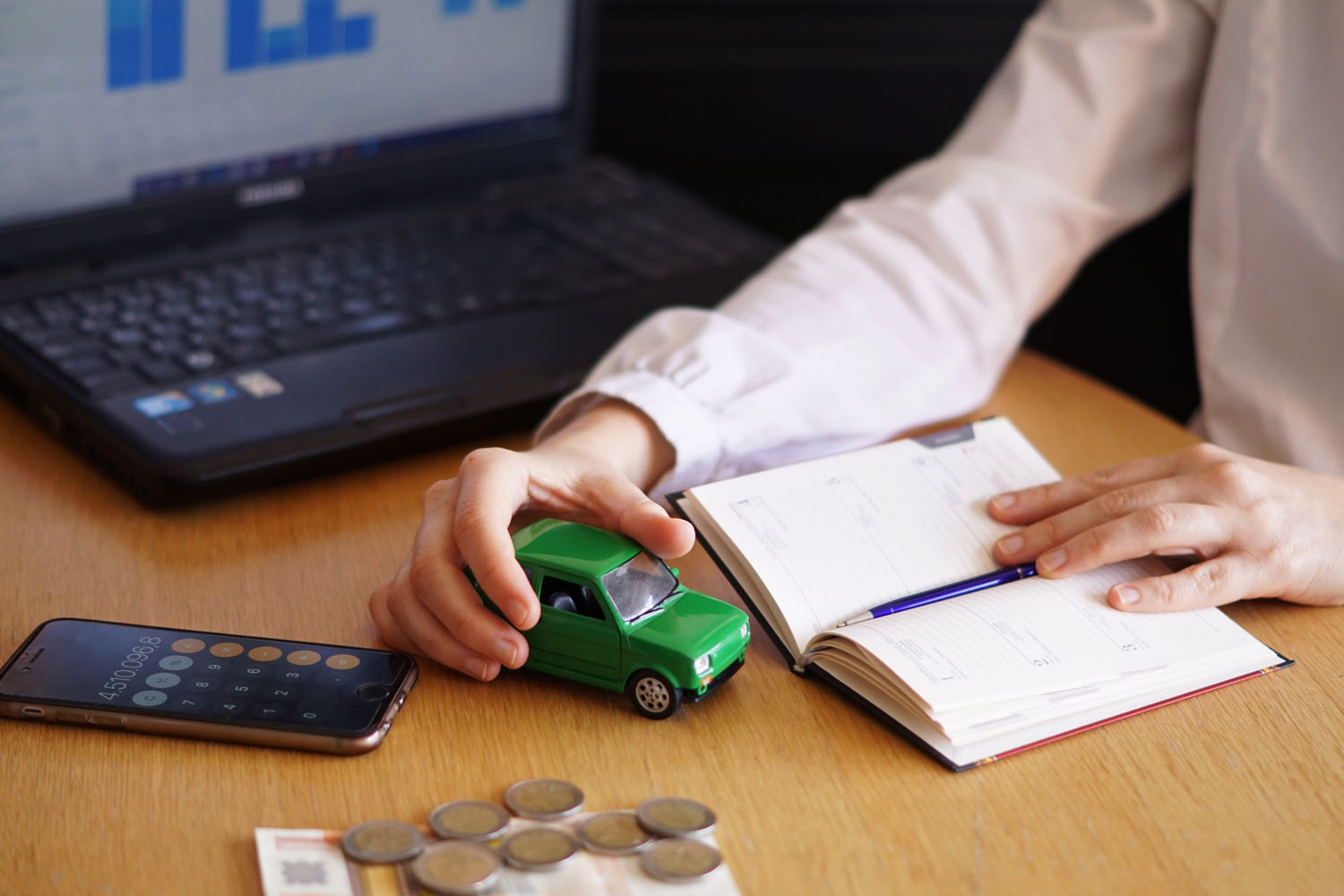 A woman researches options for a used car loan