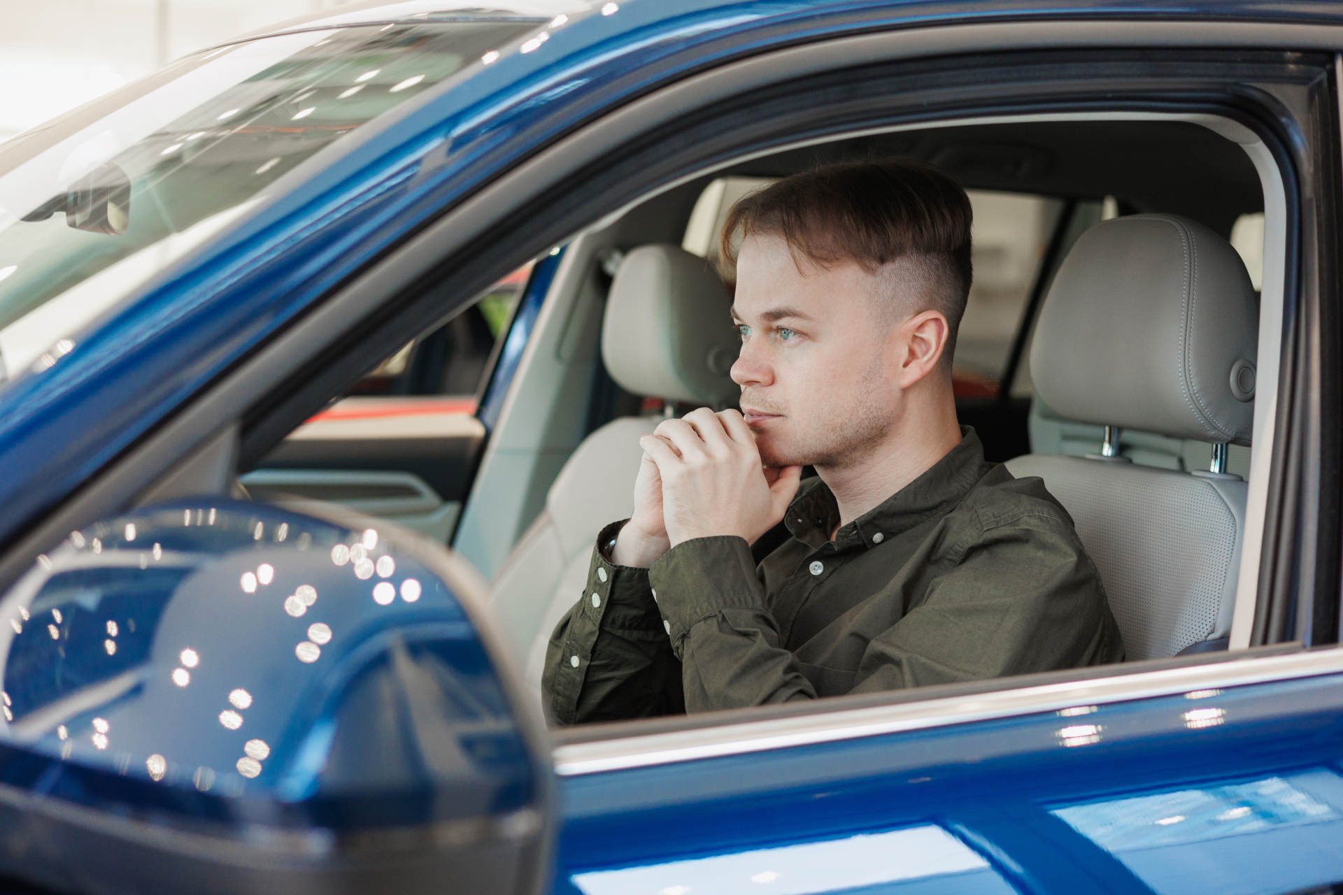 A man considers buying a used car